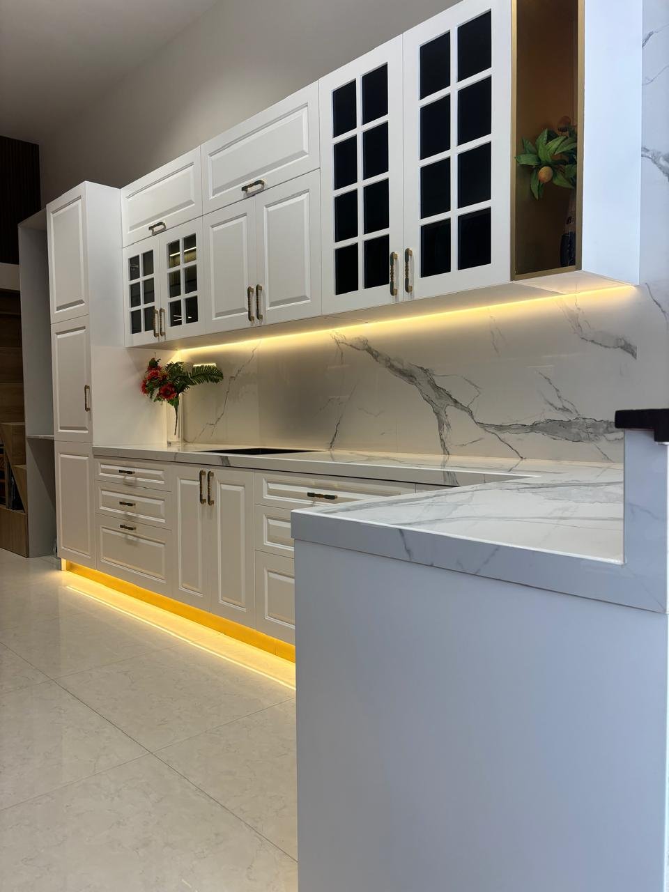 Ivory Classic Kitchen with Cove Lighting — Modular Kitchen interior by RV Homes Interiors