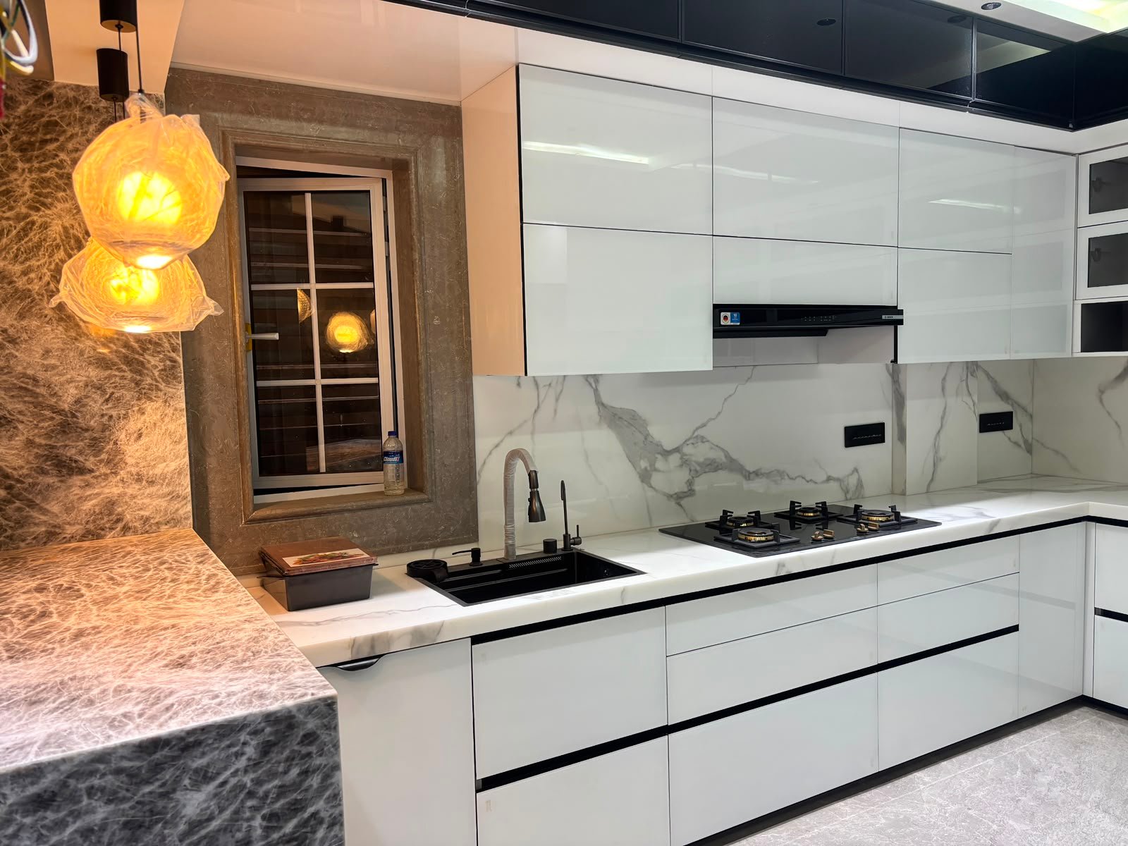 Statement Marble Island Kitchen — Modular Kitchen interior by RV Homes Interiors