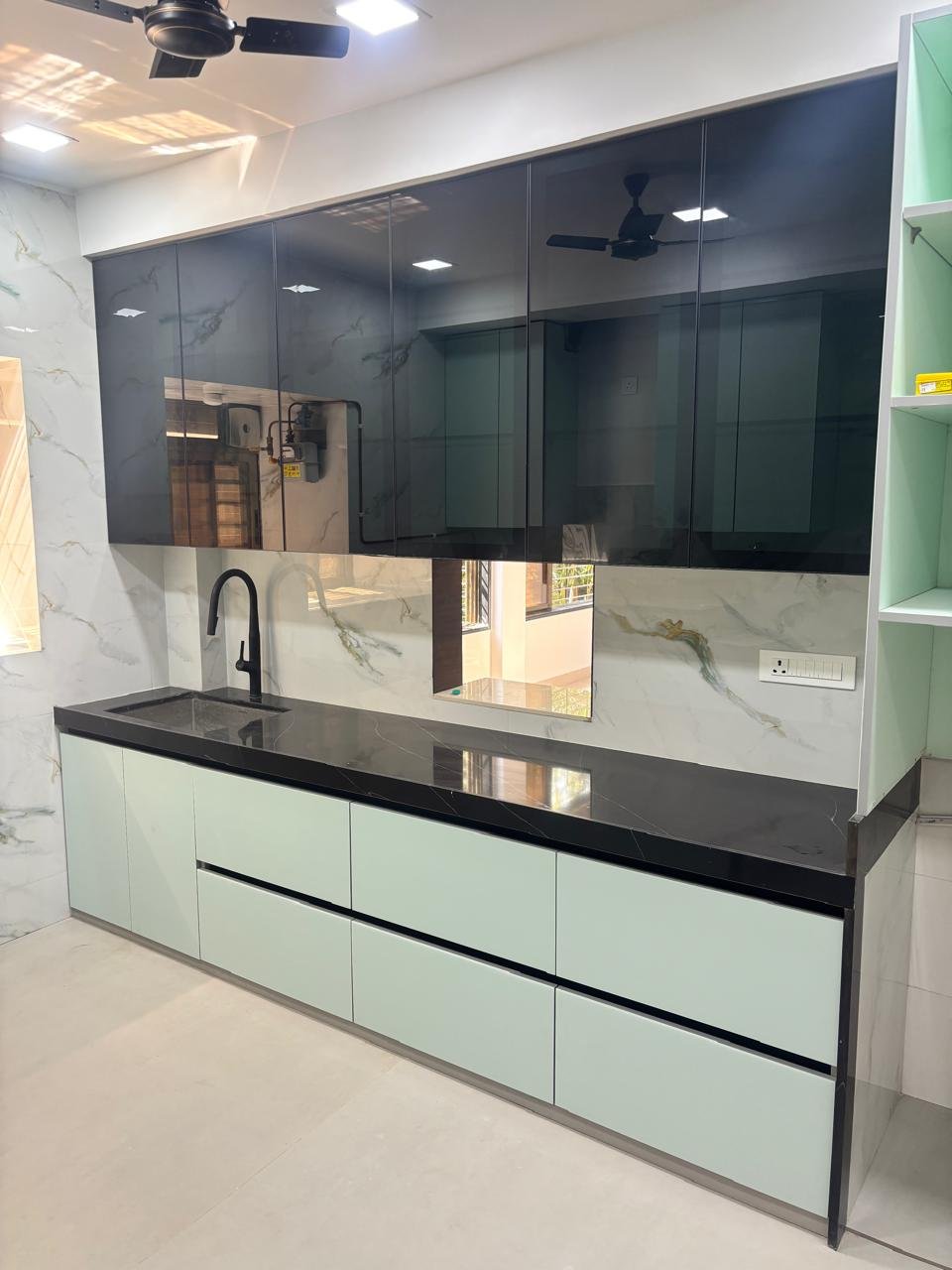 Mint & Noir Handleless Kitchen — Modular Kitchen interior by RV Homes Interiors